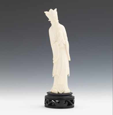 Appraisal: A Carved Ivory Figure of Scholar Depicted standing up wearing