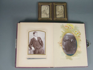 Appraisal: An Edwardian photo album containing a collection of black and