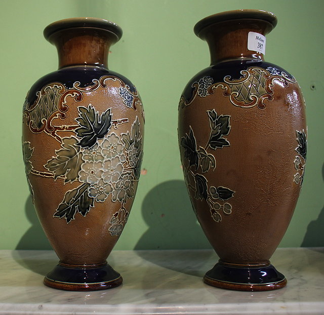 Appraisal: A PAIR OF ROYAL DOULTON BLUE AND BROWN GLAZED VASES