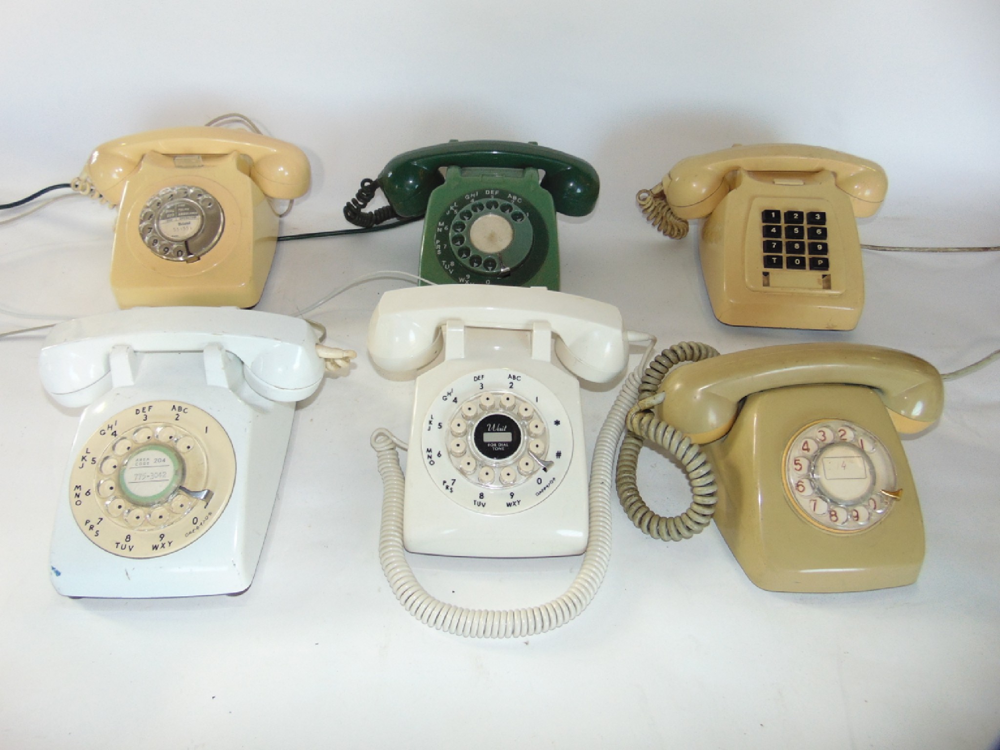 Appraisal: Three vintage ivory Bakelite cased telephone sets together with two