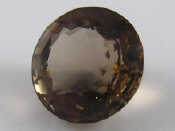 Appraisal: A large loose polished smokey quartz approx mm diameter carats