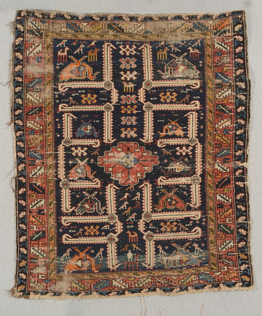 Appraisal: A SHIRVAN BLUE GROUND RUG decorated a formatted design of