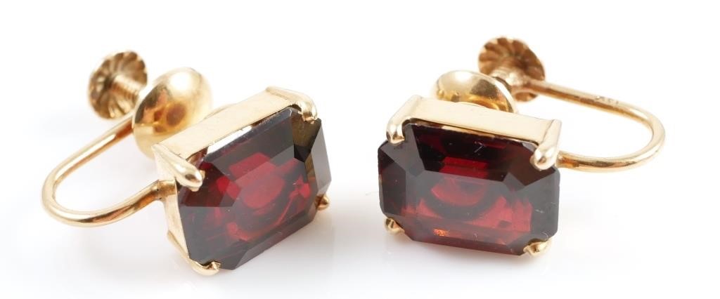 Appraisal: K GARNET EARRINGS K yellow gold earrings contain emerald cut