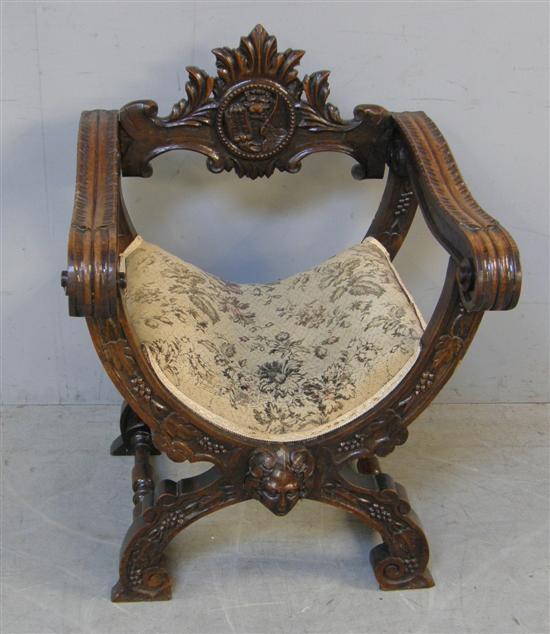 Appraisal: th century elm X- framed arm chair carved throughout h