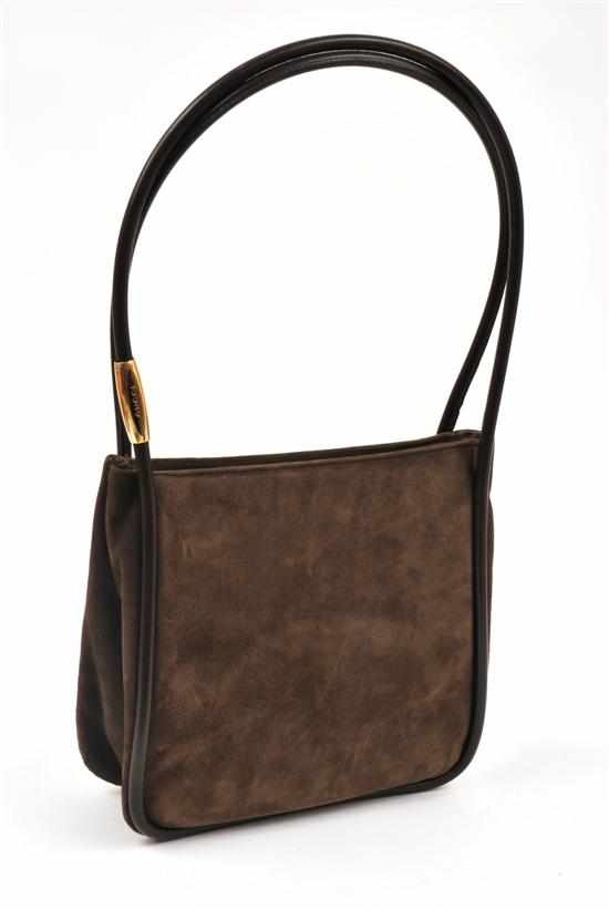 Appraisal: A SHOULDER BAG BY GUCCI Styled in taupe suede with