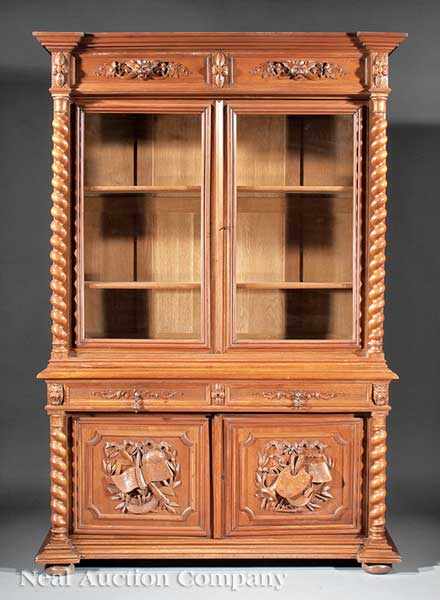 Appraisal: A French Renaissance-Style Carved Walnut Bookcase labeled Beacon Hill Collection