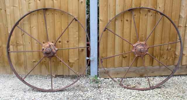 Appraisal: A PAIR OF TH TH CENTURY EIGHT SPOKE IRON WAGON