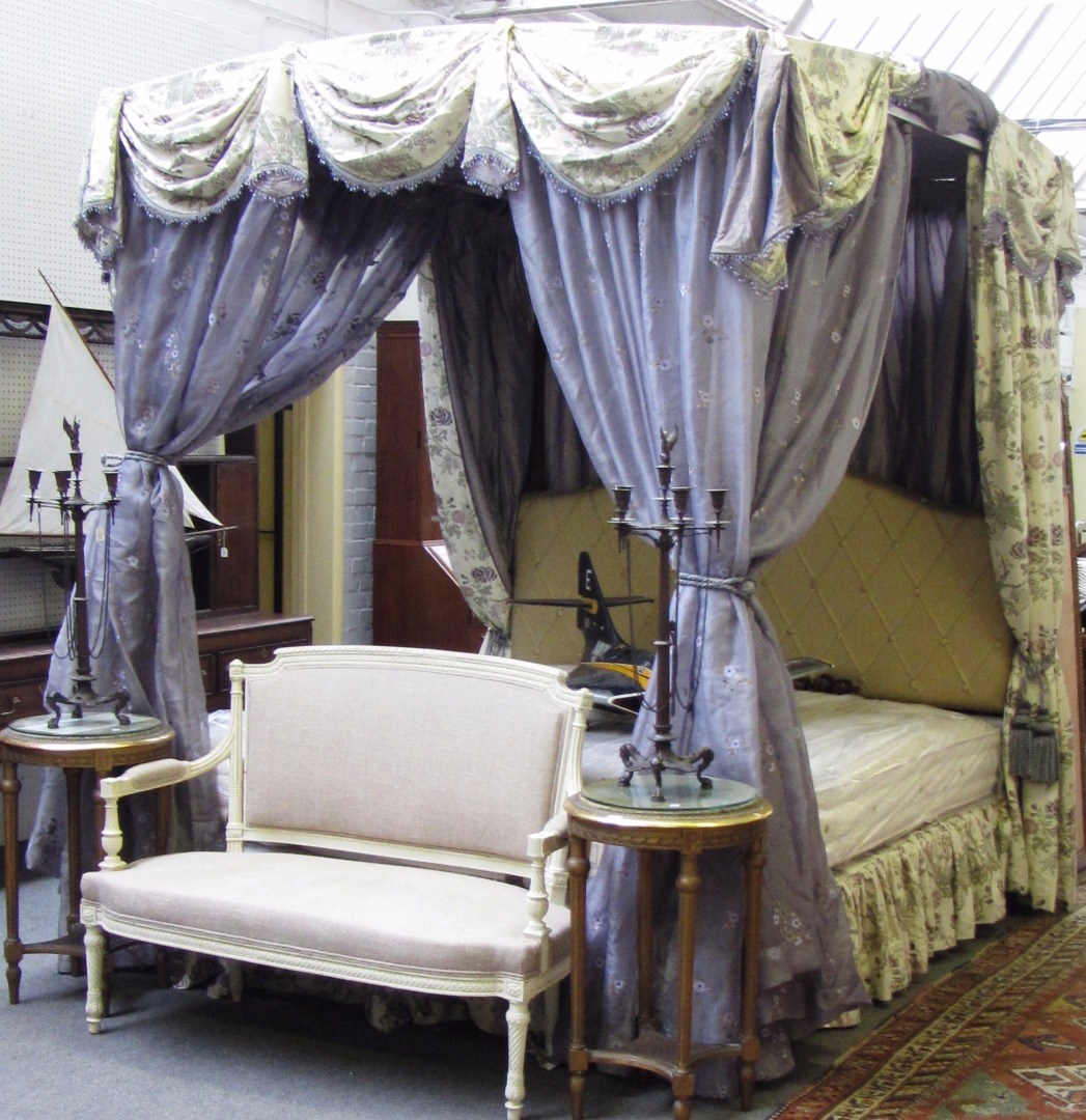 Appraisal: A th century hardwood four poster bed with pleated upholstered