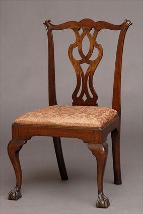 Appraisal: AMERICAN CHIPPENDALE CARVED WALNUT SIDE CHAIR The serpentine top rail