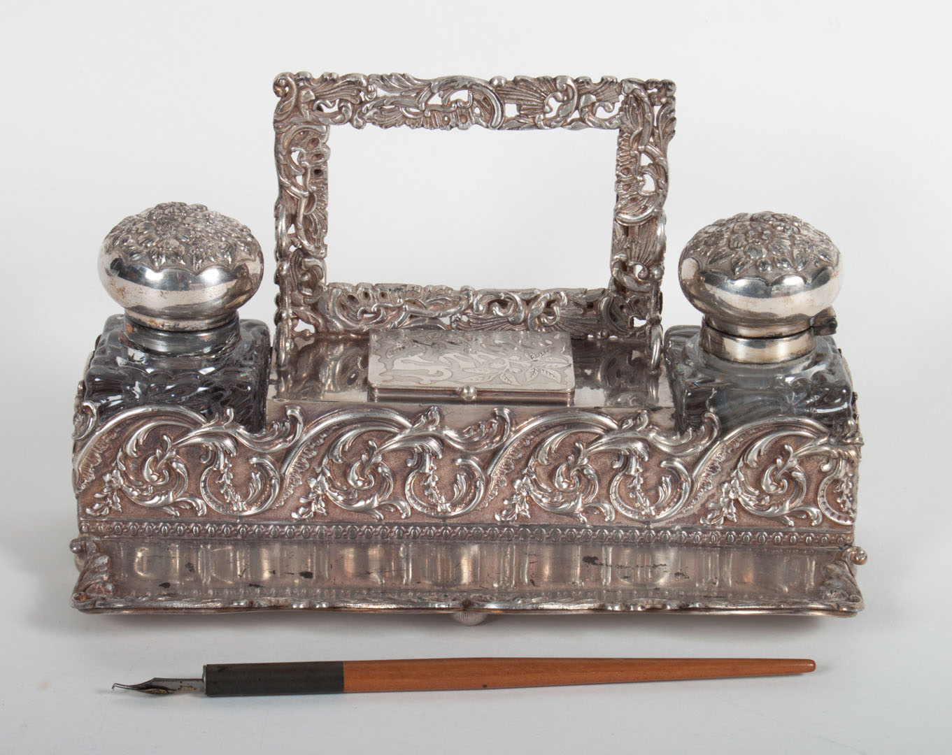 Appraisal: American repousse silver-plated standish with stamp holder and attached picture