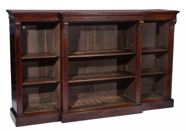 Appraisal: A VICTORIAN CARVED MAHOGANY BREAK FRONT LIBRARY BOOKCASE fitted six