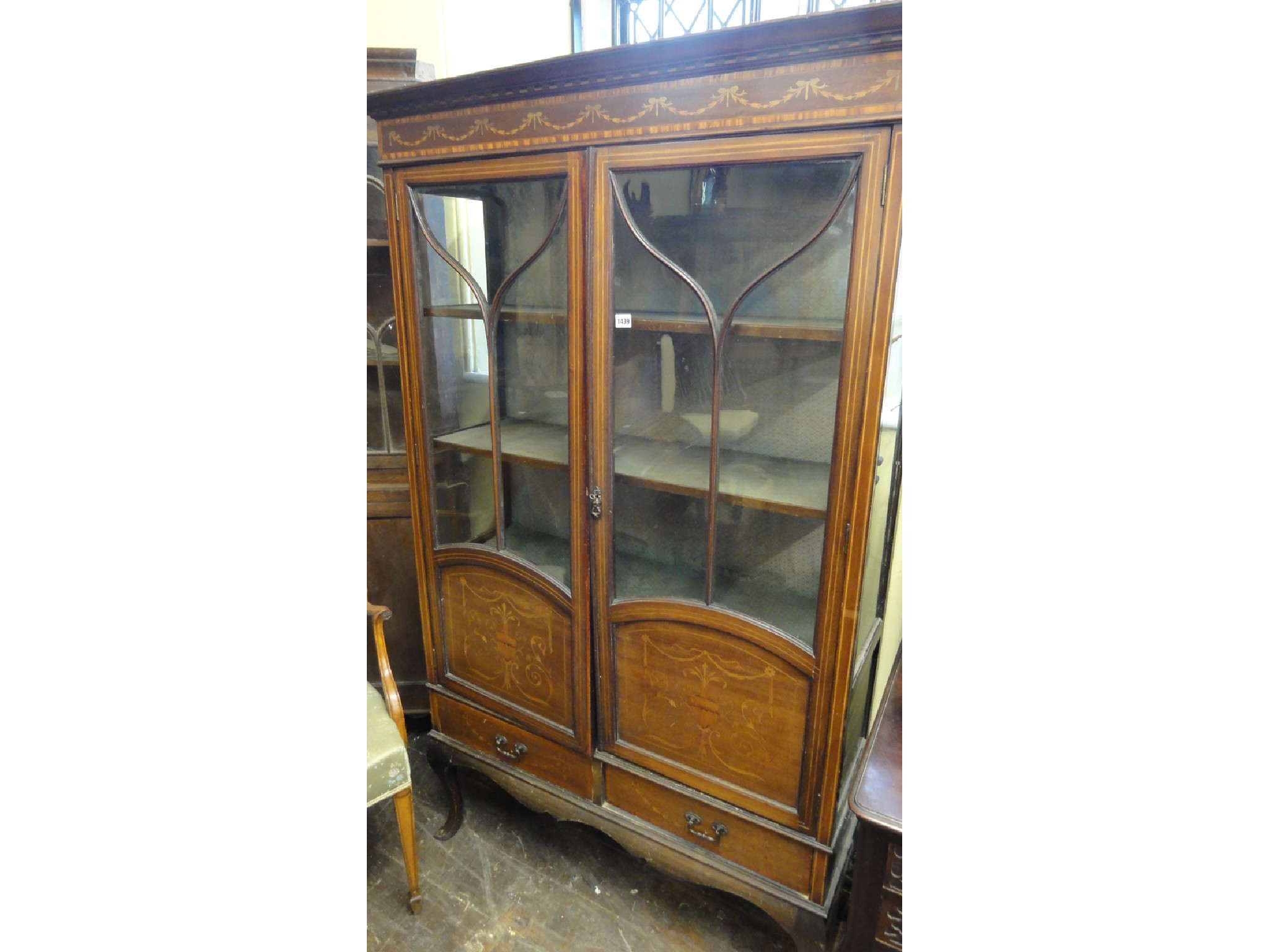 Appraisal: An Edwardian mahogany display cabinet of full height enclosed by