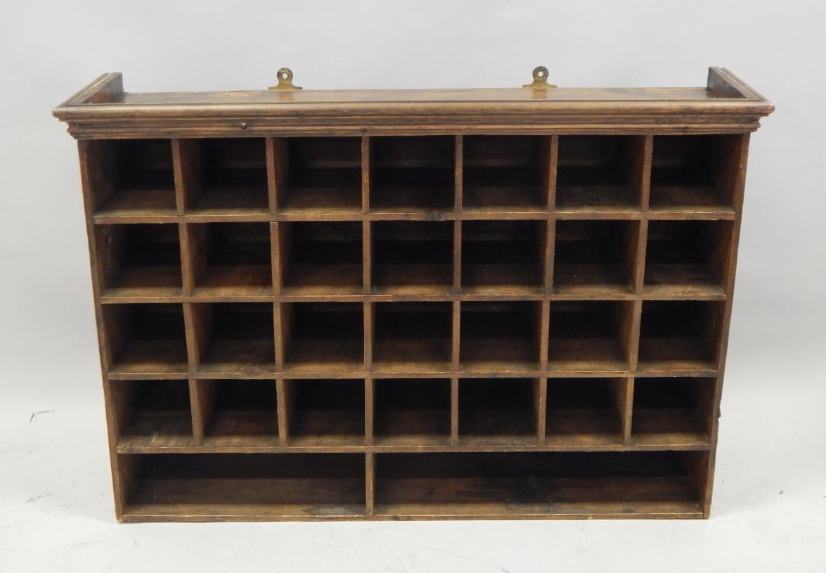 Appraisal: A collection of stained pine wall mounted pigeon holes with