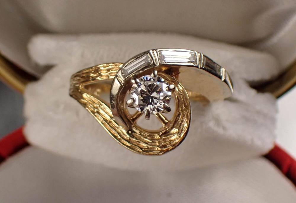 Appraisal: DIAMOND AND FOURTEEN KARAT TWO-TONE GOLD RING The k yellow