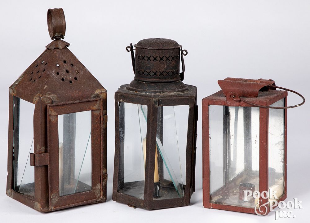 Appraisal: Three tin carry lanterns th c Three tin carry lanterns