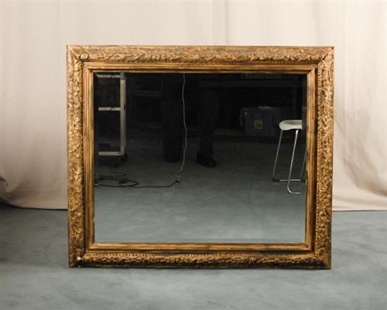 Appraisal: A Carved and Gilt Framed Wall Mirror with a floral