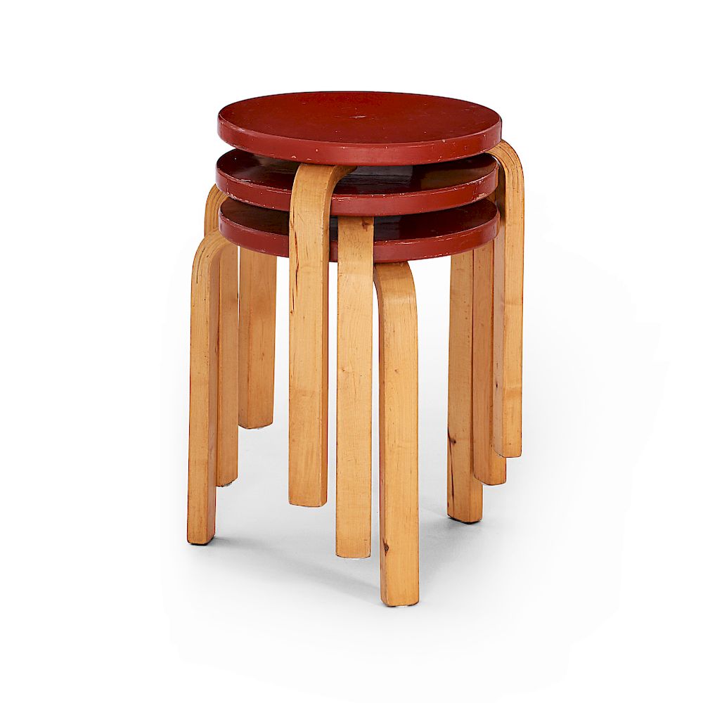 Appraisal: Alvar Aalto A stack of three Alvar Aalto's tree-legged stools