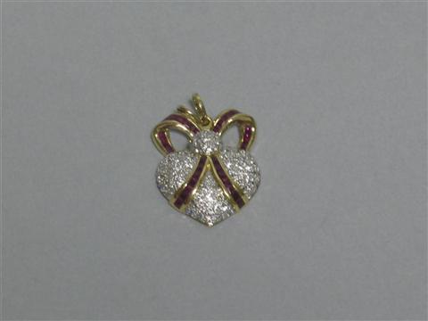 Appraisal: DIAMOND AND RUBY HEART PENDANT kt gold