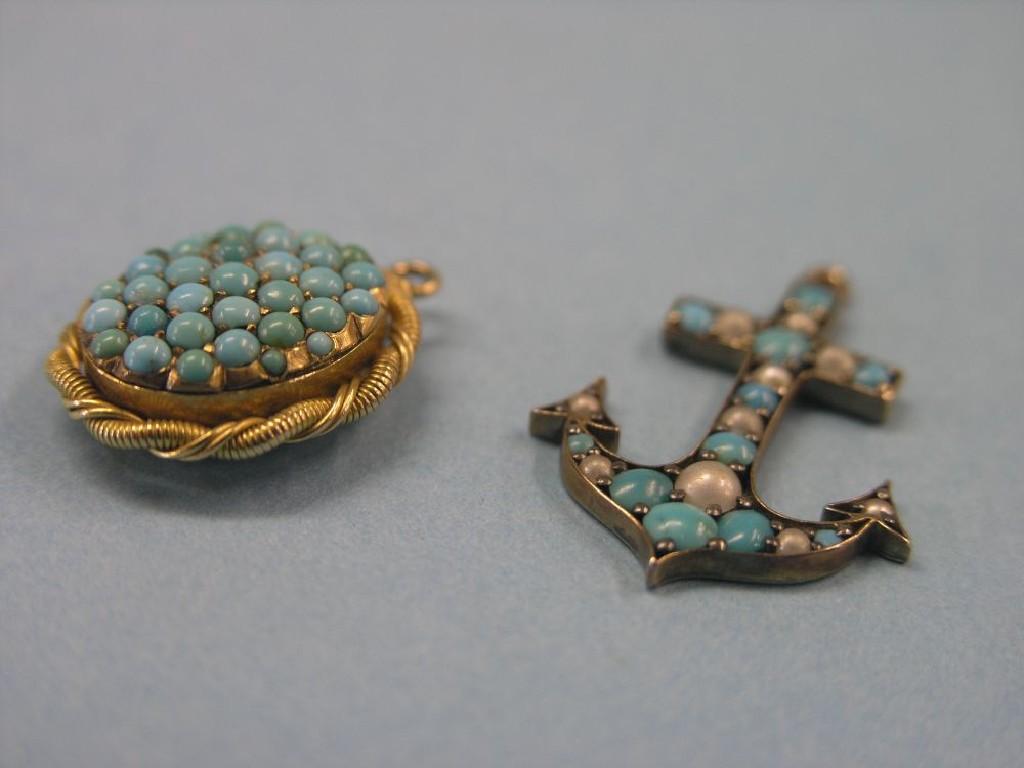 Appraisal: A gilt-metal anchor pendant inset with seed pearls and turquoises