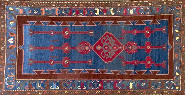 Appraisal: CAUCASIAN KAZAK Area rug with a ruby medallion on indigo