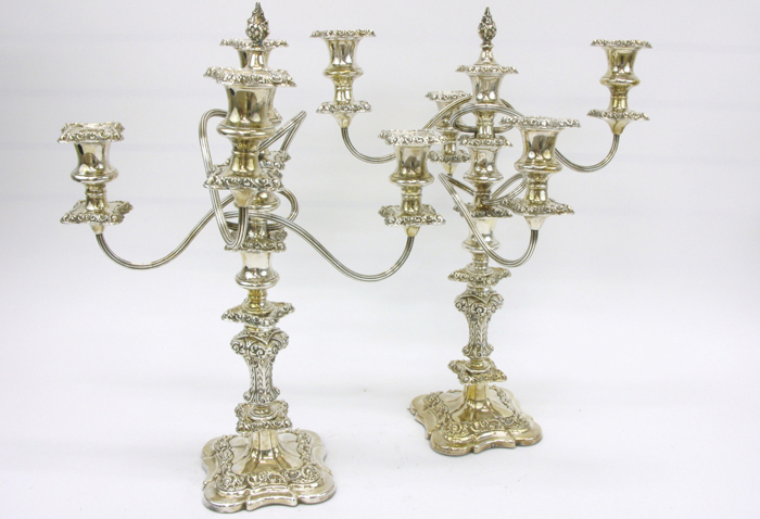 Appraisal: PAIR ENGLISH ORNATE SILVER PLATED CANDELABRA up to light having