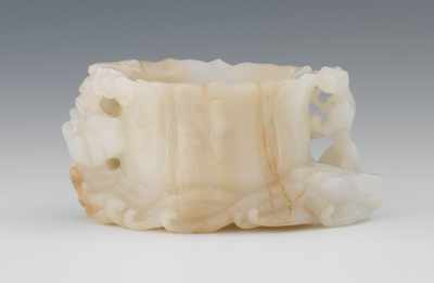 Appraisal: A Carved Jade Brush Washer Lotus form bowl flanked with