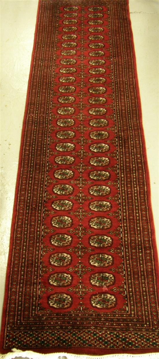 Appraisal: Modern Persian red ground runner multiple borders the centre with