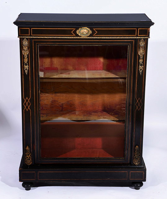 Appraisal: A LATE VICTORIAN EBONISED SIDE CABINET the interior fitted two