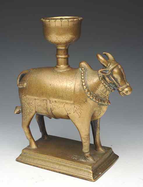 Appraisal: AN INDIAN ISLAMIC CANDLE HOLDER in the form of an