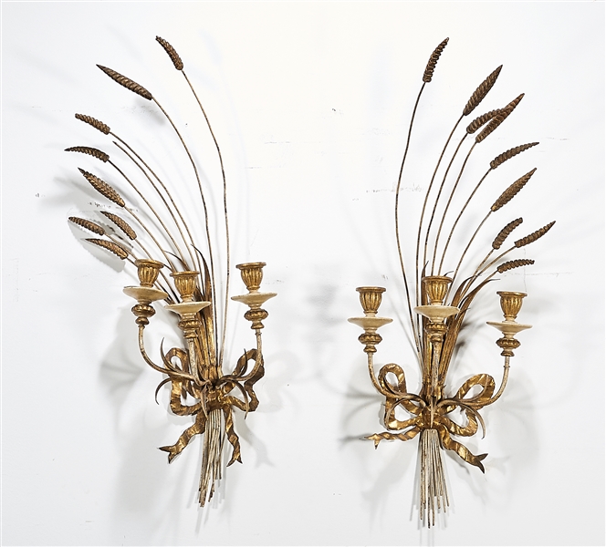 Appraisal: Pair of gilt metal and wood three-light sconces each of