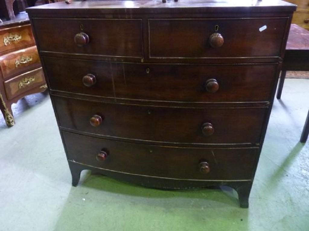 Appraisal: An early th century mahogany bow fronted chest fitted with