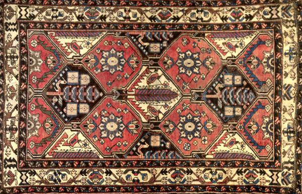 Appraisal: PERSIAN BAKHATIARI Area rug with diamond medallions in cranberry ivory