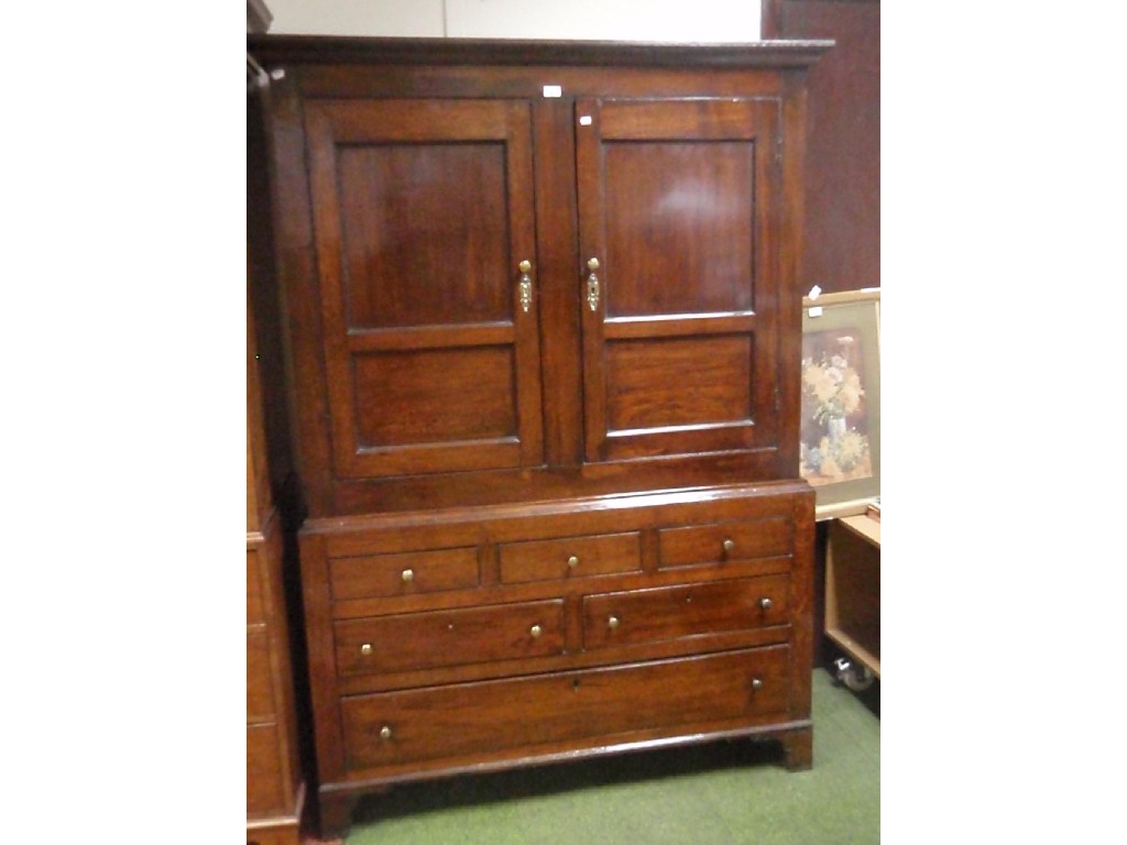 Appraisal: An th century oak press cupboard with moulded corners over