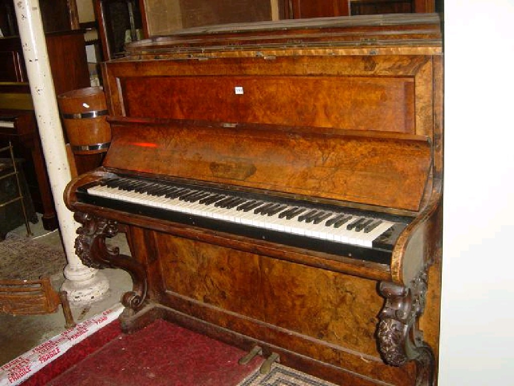 Appraisal: A Victorian walnut and figured walnut cased over strung upright