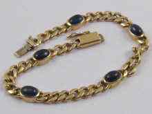 Appraisal: A yellow metal tests ct gold cabochon sapphire bracelet approx