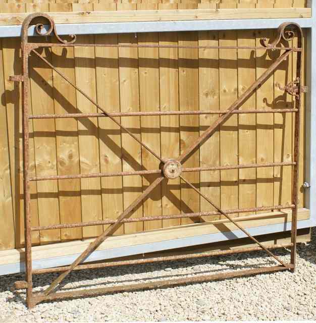 Appraisal: A VICTORIAN WROUGHT IRON GARDEN GATE with scrolling finials wide