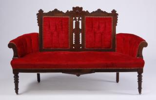 Appraisal: Early th century American Eastlake carved mahogany settee with burl