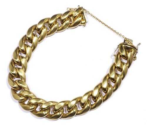 Appraisal: GOLD BRACELET Yellow gold g Casual-elegant half-solid curb link bracelet