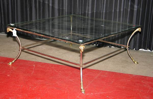 Appraisal: A patinated metal and brass coffee table modern