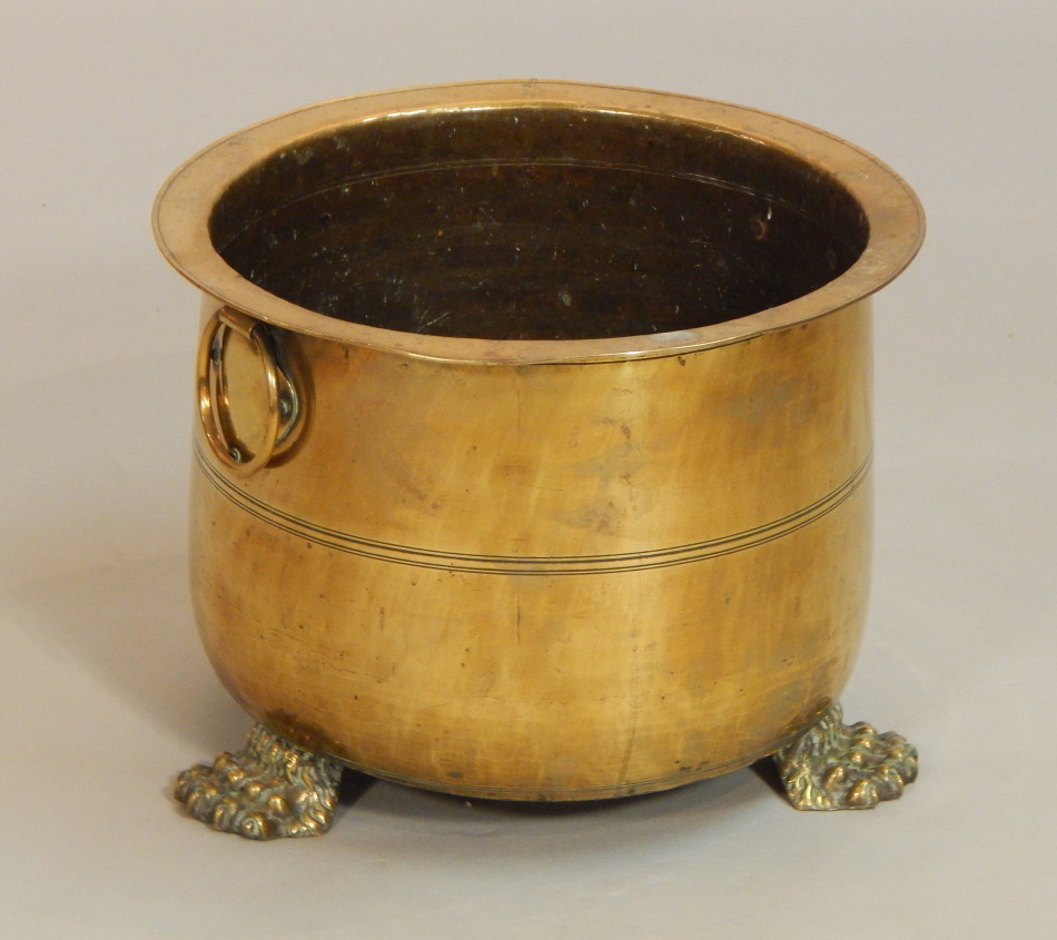 Appraisal: A brass two handled coal bucket with paw feet cm