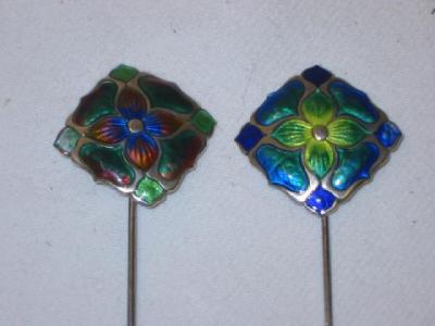 Appraisal: A PAIR OF ARTS AND CRAFTS ENAMEL HAT PINS of