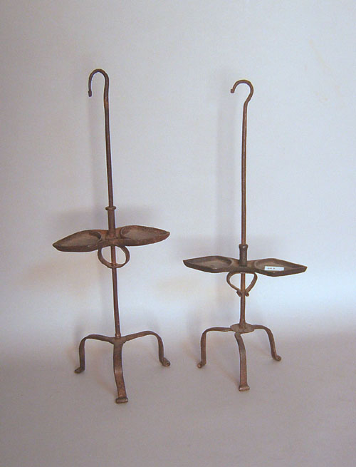 Appraisal: Two wrought iron lamp stands th and th c tallest