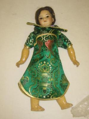 Appraisal: A German Oriental bisque doll with brown fixed eyes open