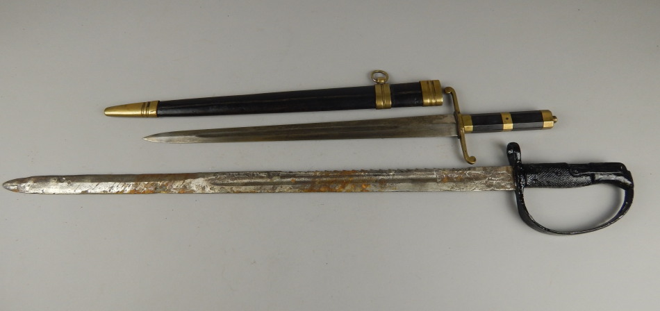 Appraisal: A Continental short sword with brass mounts and leather scabbard