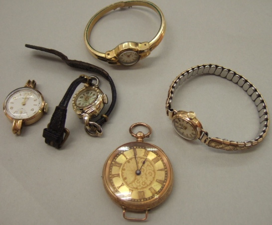 Appraisal: A ladies gold cased openfaced fob watch the decorated gilt