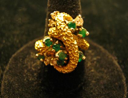 Appraisal: karat yellow gold emerald and diamond cluster ringGold wrap design