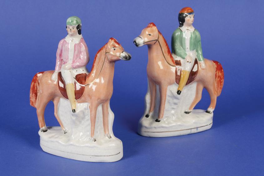 Appraisal: A PAIR OF TH CENTURY STAFFORDSHIRE FLATBACK FIGURES of jockeys