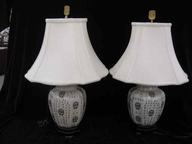 Appraisal: Pair of Oriental Pottery Lamps calligraphy decor on temple jars