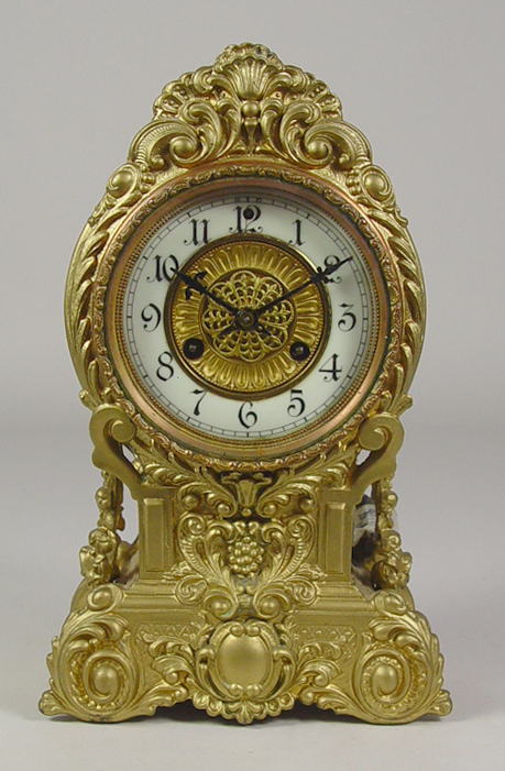 Appraisal: Waterbury Brass Clock Circa Enameled Arabic dial In gold painted