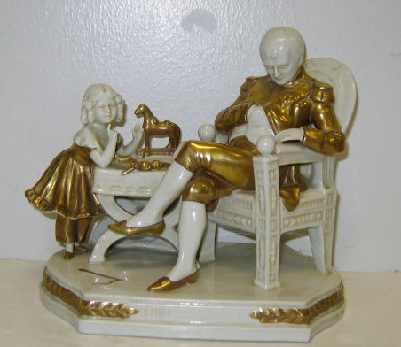 Appraisal: GERMAN PORCELAIN GROUP NAPOLEON WITH DAUGHTER Depicting Napoleon sleeping in